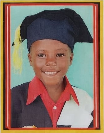 Happy student in graduation cap and red shirt, celebrating educational sponsorship success.